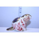 A Royal Crown Derby paperweight beaver with gold stopper