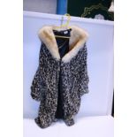 A vintage leopard print coat with fur coat