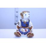 A Royal Crown Derby paperweight, School girl Teddy with gold stopper
