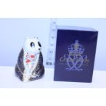 A Royal Crown Derby boxed paperweight, panda with gold stopper