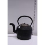 A antique cast iron kettle