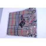A new with tags tan Burberry scarf