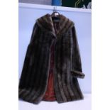 A full length ladies fur coat