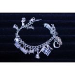 A vintage silver 925 charm bracelet and charms