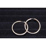 A large pair of 9ct gold hooped earrings 3.50 grams