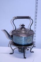 A silver plated spirit kettle with burner