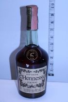 A vintage sealed bottle of Hennessey Cognac