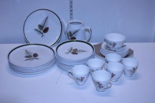 A selection of Langley pinecone pattern plates and a Queen Anne bone china tea service