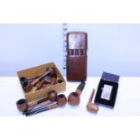 A selection of vintage smoking pipes along with a cigar case and ben sherman lighters