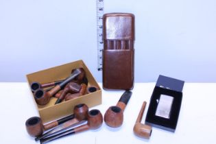 A selection of vintage smoking pipes along with a cigar case and ben sherman lighters