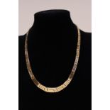 A quality 14ct gold necklace in a greek key design. 33.54