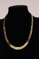 A quality 14ct gold necklace in a greek key design. 33.54