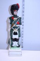 A large ceramic musical military figure