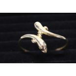 A solid 14ct gold bangle in the form of two dolphins. 14.44 grams.
