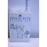 A boxed drinking water filter kit