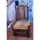 A vintage light oak rocking chair with wicker work seat, shipping unavailable