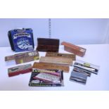 A job lot of assorted vintage Domino sets and other including harmonica's etc
