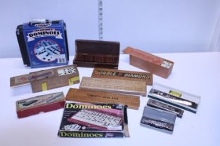 A job lot of assorted vintage Domino sets and other including harmonica's etc