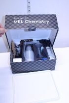 A boxed MEI chemistry starter set