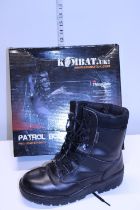 A pair of lightly worn men's leather patrol boots size 8