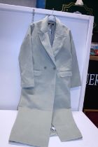 A new ladies Misguided coat size 8