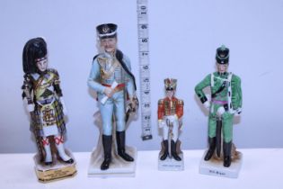 Four ceramic military figures