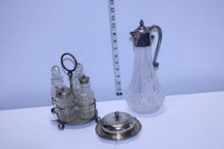 A selection of assorted plated ware and cut glass claret jug