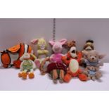 A large job lot of assorted Disney and other soft toys