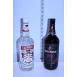 A vintage sealed bottle of Smirnoff Vodka & a vintage sealed bottle of Captain Morgan's Dark Rum