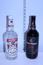 A vintage sealed bottle of Smirnoff Vodka & a vintage sealed bottle of Captain Morgan's Dark Rum