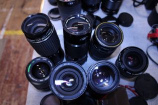A job lot of assorted 35mm camera lenses etc