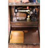 A antique manual singer sewing machine in case. Shipping unavailable