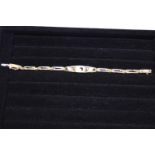 A quality 18ct gold bracelet set with diamonds. 14.31 grams