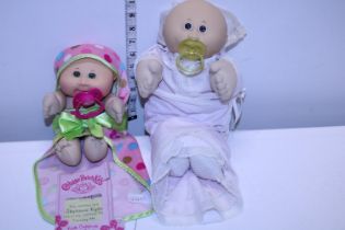 A vintage Cabbage Patch doll and one other with certificate