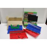 Two boxed Subbuteo stadium grand stands and a box of other accessories including scoreboard