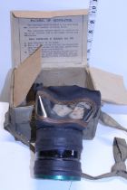 A World War Two period gas mask in original carry case