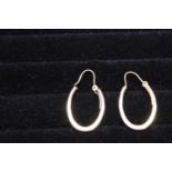 A pair of 9ct gold horse shoe shaped earrings 1.92 grams.