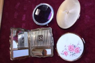 A selection of vintage ladies compacts including Stratton