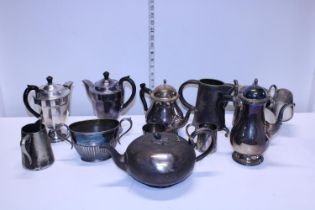 A job lot of assorted silver plate tea pots etc