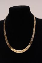 A quality 14ct gold necklace in a greek key design. 33.54 grams 48cm long