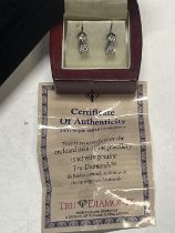 A pair of Tru diamonds earrings