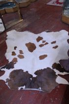 A cow hide rug approx 163x176cm