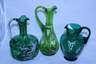 Three Victorian green glass jugs
