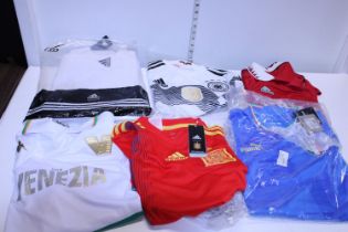 A selection of assorted size sports shirts, mostly new with tags