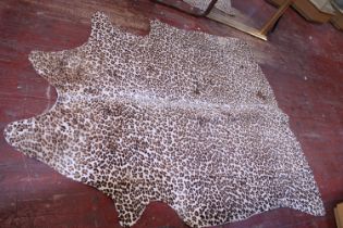 A leopard print cow hide rug 200x153 approx.