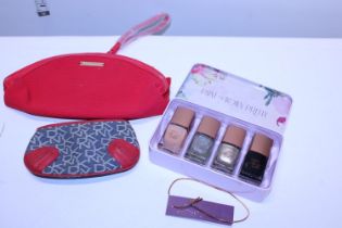 A Ted Baker nail polish set with a DKNY purse and a Giorgio Armani cosmetic bag
