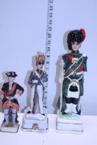 A military themed musical decanter with a musical military figure and one other
