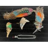 A selection of feather costume brooches
