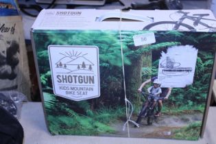 A boxed Shotgun kids mountain bike seat