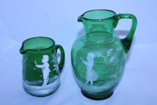 Two Mary Gregory glass jugs